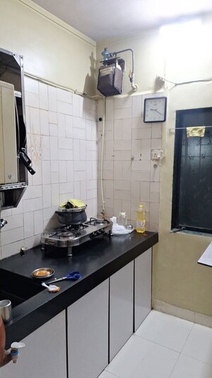 Kitchen in 1 BHK Apartment at Gokuldham Complex, Goregaon East – for Rent