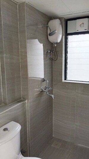 Bathroom in 1 BHK Apartment at Runwal Gardens, Dombivli East – for Rent