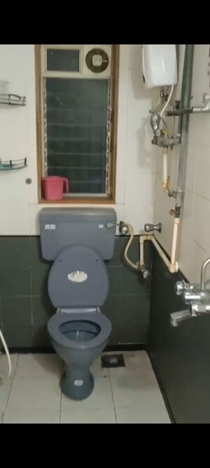 Bathroom in 2 BHK Apartment at Andheri CHS, Andheri West – for Rent