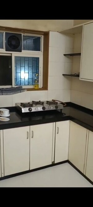 Kitchen in 2 BHK Apartment at Andheri CHS, Andheri West – for Rent