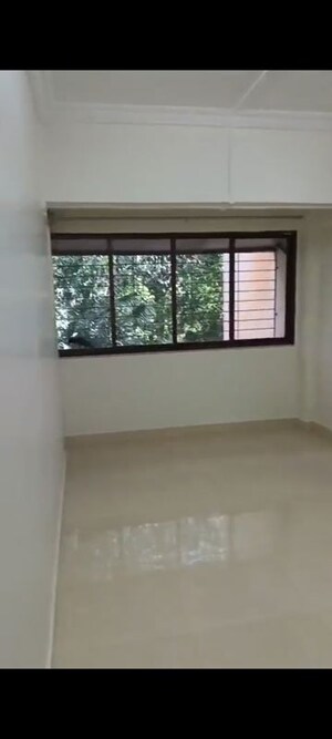 Room in 2 BHK Apartment at Andheri CHS, Andheri West – for Rent