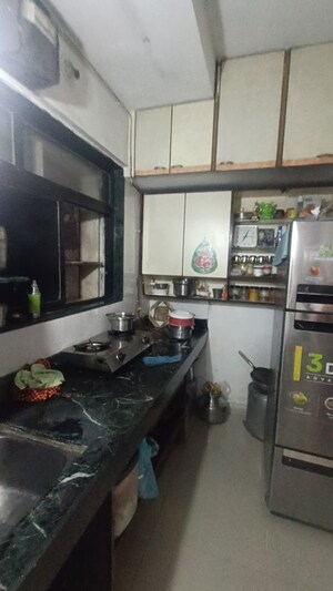 Kitchen in 1 BHK Apartment at Jaswanti Residency, Kandivali West – for Sale