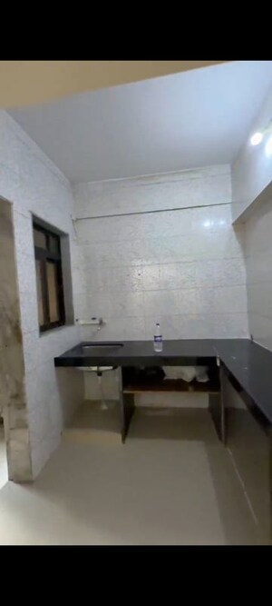 Kitchen in 2 BHK Apartment at Andheri CHS, Andheri West – for Rent