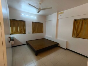 Bedroom in 1.5 BHK Apartment at Urmila CHS Dhankawadi, Dhankawadi – for Rent
