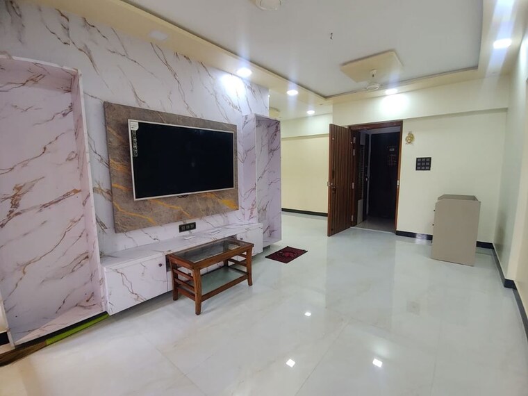 Living Room, garden-view-apartment 2.5 Bedroom 981 Sq.Ft. Apartment In Goregaon East Mumbai 10751155
