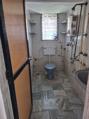 Living Room in 2 BHK Apartment at Park Avenue Apartment Kandivali, Kandivali West – for Rent