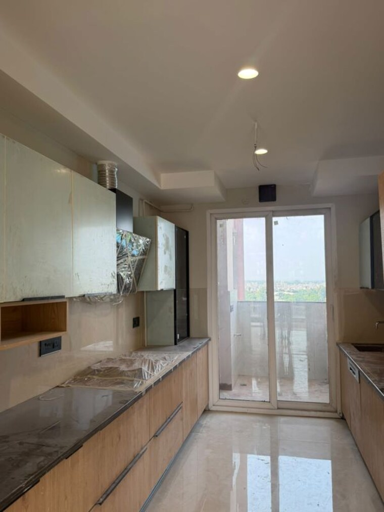 Kitchen, the-ananta-aspire 3.5 Bedroom 2200 Sq.Ft. Apartment In Utrathiya Zirakpur 10751390