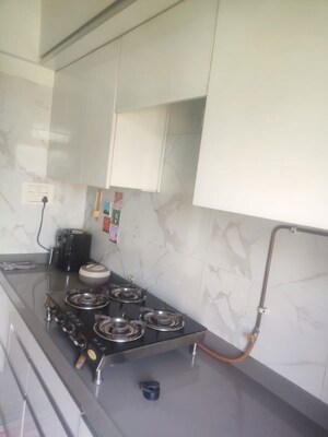 Kitchen in 1.5 BHK Apartment at Vihang Vermont, Ghodbunder Road – for Sale