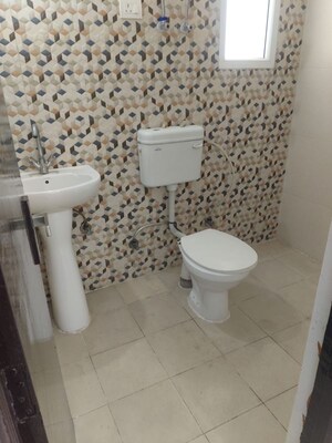 Bathroom in 2 BHK Apartment at Nilaya Greens, Raj Nagar Extension – for Rent