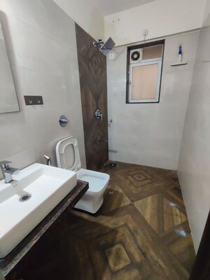 Bathroom in 2 BHK Apartment at Shree Tirupati STG Signature Residency, Patlipada – for Rent