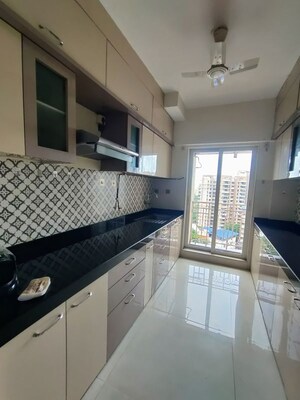 Kitchen in 2 BHK Apartment at Shree Tirupati STG Signature Residency, Patlipada – for Rent