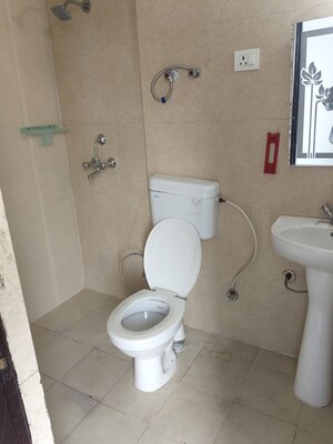 Bathroom in 1 BHK Apartment at Nilaya Greens, Raj Nagar Extension – for Rent