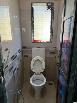 Bathroom in 1.5 BHK Apartment at Dosti West County, Balkum Pada – for Rent