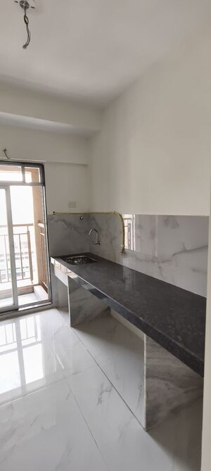 Kitchen in 1 BHK Apartment at Anant Metropolis Insignia Towers, Kasarvadavali – for Sale