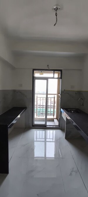 Kitchen in 1 BHK Apartment at Anant Metropolis Insignia Towers, Kasarvadavali – for Sale