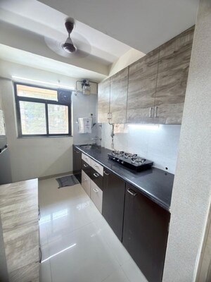 Kitchen in 1.5 BHK Apartment at Dosti West County, Balkum Pada – for Rent