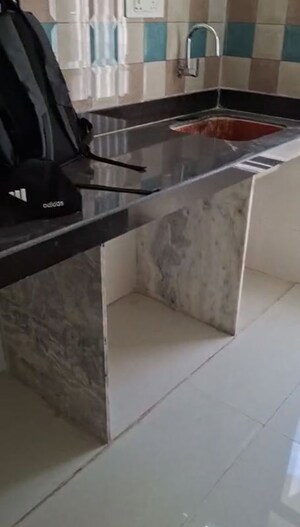Kitchen in 1 BHK Apartment at Puneet Shivalaya, Tagore Nagar – for Sale