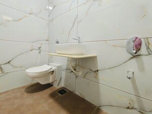 Bathroom in 2 BHK Apartment at Raunak Unnathi Woods Supreme, Ghodbunder Road – for Rent