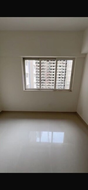 Room in 2 BHK Apartment at Omkar Signet, Malad East – for Rent