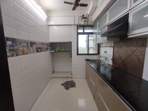 Kitchen in 1 BHK Apartment at Puranik Hometown, Ghodbunder Road – for Rent