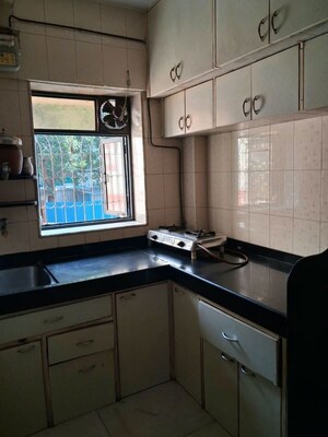 Kitchen in 1 BHK Apartment at Jai Ashirwad CHS, Dahisar West – for Sale