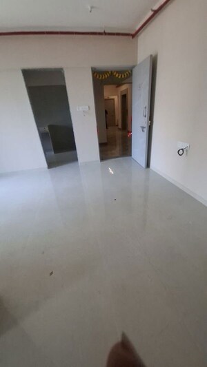 Living Room in 2 BHK Apartment at Raunak Unnathi Woods Supreme, Ghodbunder Road – for Rent