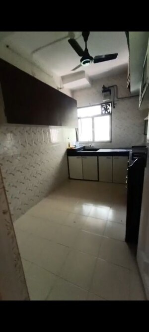 Kitchen in 2 BHK Apartment at Andheri CHS, Andheri West – for Rent
