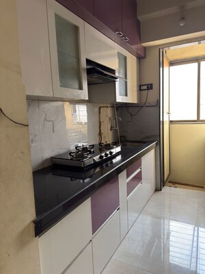 Kitchen in 1 BHK Apartment at VR Bhoomi Acres H wing, Waghbil – for Rent