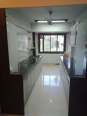 Kitchen in 2 BHK Apartment at Express Apartment, Yari Road – for Rent