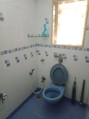 Bathroom in 2 BHK Apartment at Express Apartment, Yari Road – for Rent