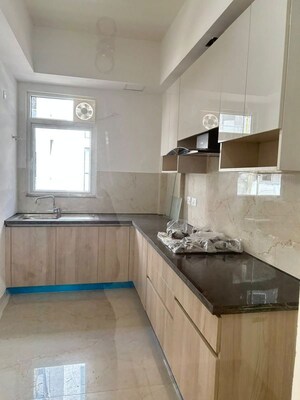 Kitchen in 2.5 BHK Apartment at Smart World Orchard, Sector 61 – for Rent