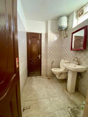 Bathroom in 4 BHK Apartment at Dhakoli – for Rent