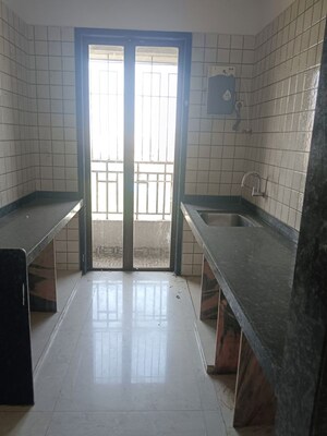 Kitchen in 2 BHK Apartment at Runwal Gardens, Dombivli East – for Rent