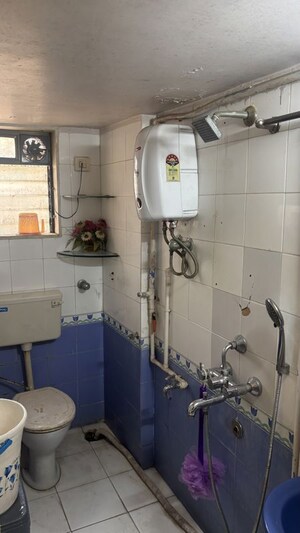 Bathroom in 2 BHK Apartment at Chamunda Heritage, Andheri East – for Rent
