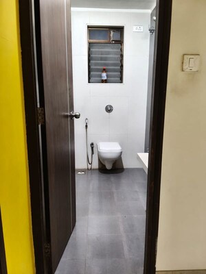 Bathroom in 2 BHK Apartment at Harmony Signature Towers, Owale – for Rent