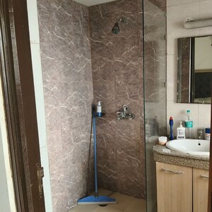 Washroom in 1 RK Apartment at Nimbus The Golden Palm, Sector 168 – for Rent