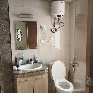 Bathroom in 1 RK Apartment at Nimbus The Golden Palm, Sector 168 – for Rent
