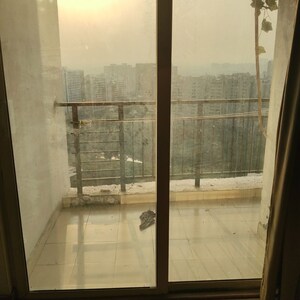 Balcony in 1 RK Apartment at Nimbus The Golden Palm, Sector 168 – for Rent