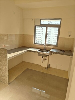 Kitchen in 1.5 BHK Apartment at Piramal Vaikunth, Balkum Pada – for Rent