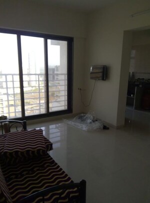 Living Room in 1 BHK Apartment at Swaraj Bella Vista, Ghansoli – for Rent