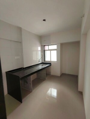 Kitchen in 1 BHK Apartment at Purshottam Nayan, Ghodbunder Road – for Rent