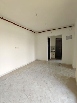 Living Room in 1 BHK Apartment at Metropolis Bayside, Kasarvadavali – for Rent