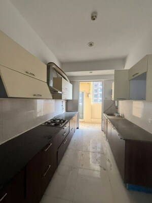 Kitchen in 4 BHK Apartment at Mahagun Mirabella, Sector 79 – for Rent