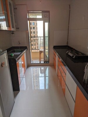Kitchen in 2 BHK Apartment at Rustomjee Urbania Azziano, Thane West – for Rent