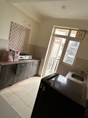Kitchen in 2.5 BHK Apartment at Amrapali Silicon City, Sector 76 – for Sale