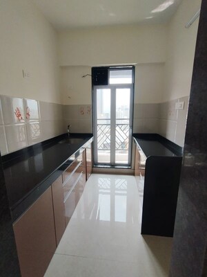Kitchen in 1 BHK Apartment at Pride Larkins Nest, Ghodbunder Road – for Rent