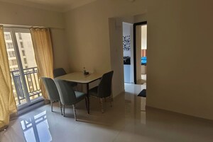 Living Room in 1 BHK Apartment at Raunak Bliss, Ghodbunder Road – for Rent