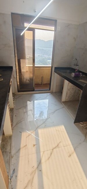 Kitchen in 2 BHK Apartment at Ram Pushpanjali Residency, Owale – for Rent