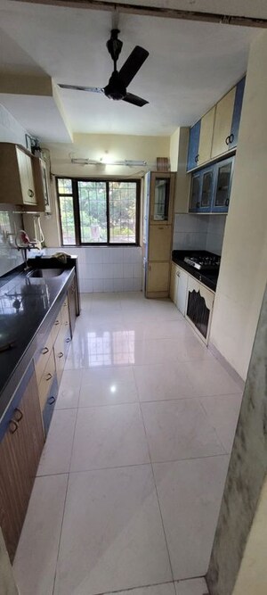 Kitchen in 2 BHK Apartment at Hyde Park Galaxy, Manpada – for Rent
