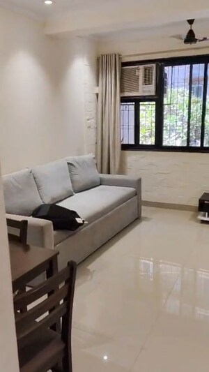 Team Area in 1 BHK Apartment at Kamal Kunj Vile Parle, Vile Parle West – for Rent